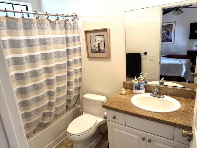 ensuite bathroom featuring toilet, shower / bath combination with curtain, connected bathroom, and vanity