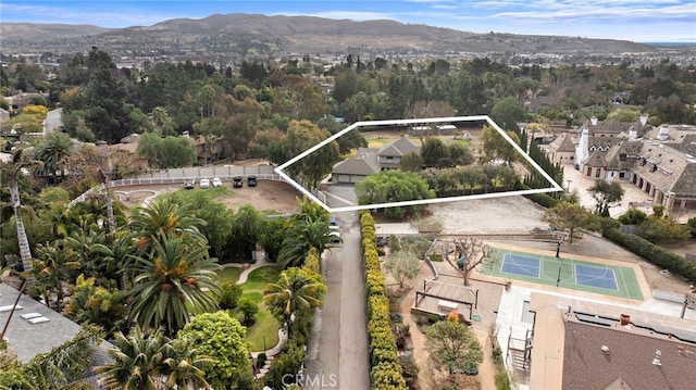 birds eye view of property with a residential view and a mountain view