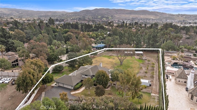 birds eye view of property featuring a mountain view