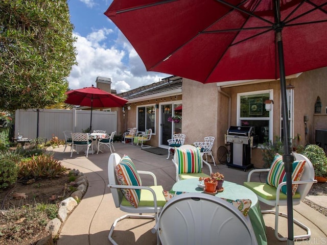 view of patio featuring a grill