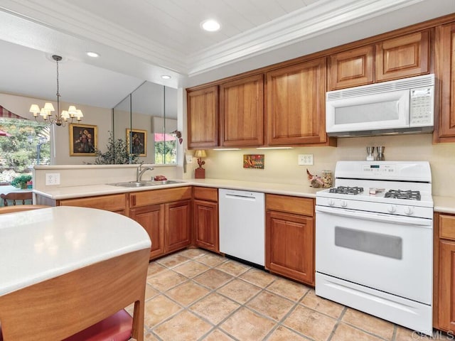 kitchen with sink, crown molding, hanging light fixtures, light tile patterned floors, and white appliances