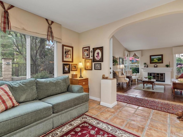 tiled living room with vaulted ceiling