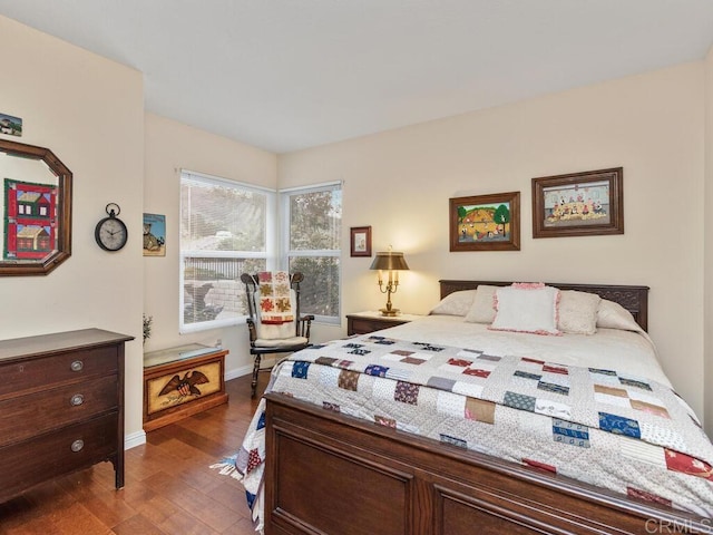 bedroom featuring dark hardwood / wood-style floors