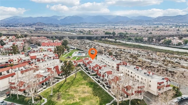 birds eye view of property with a mountain view