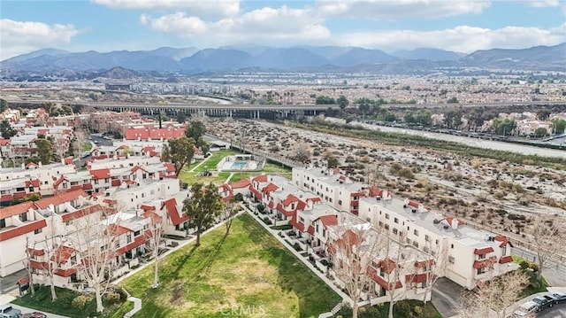 birds eye view of property featuring a mountain view