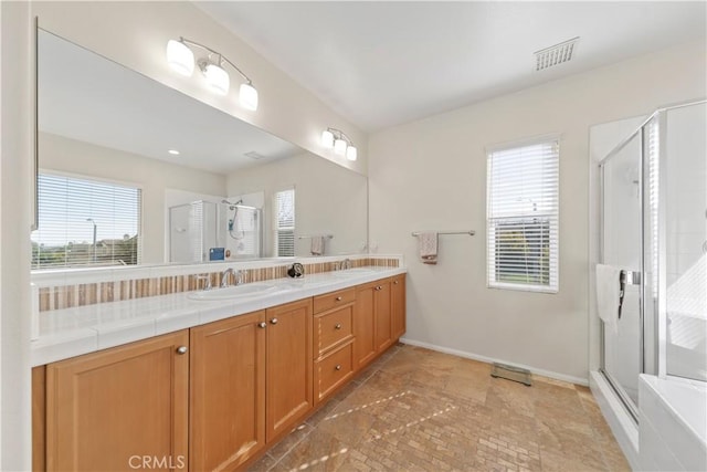 bathroom featuring vanity and walk in shower