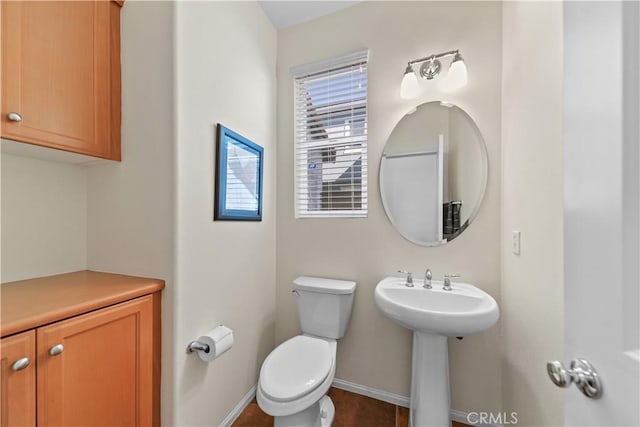 bathroom featuring toilet and sink