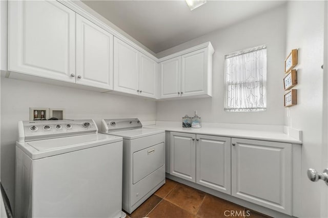 laundry room featuring cabinets and washing machine and clothes dryer