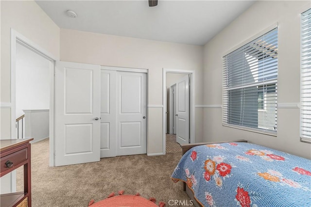 carpeted bedroom featuring a closet