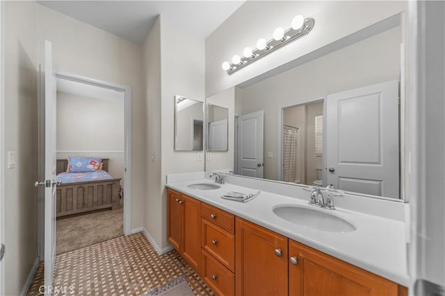 bathroom with vanity and toilet