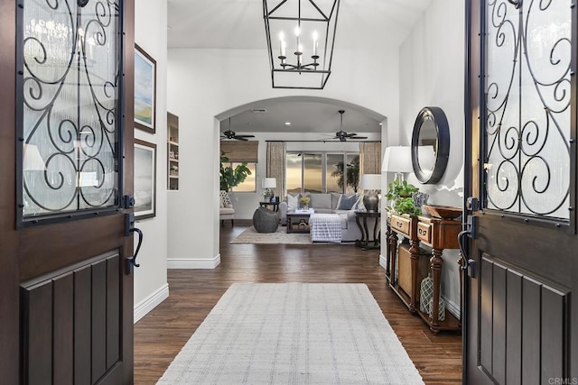 foyer with dark wood-type flooring and ceiling fan