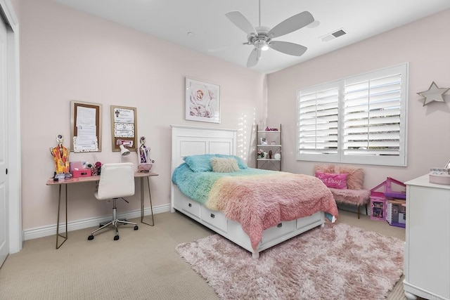 bedroom featuring ceiling fan and light carpet