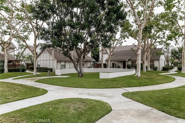 view of property's community with a residential view and a yard