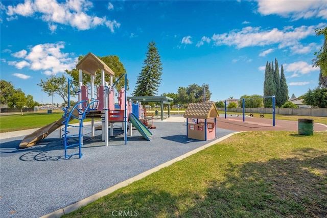 communal playground featuring a yard