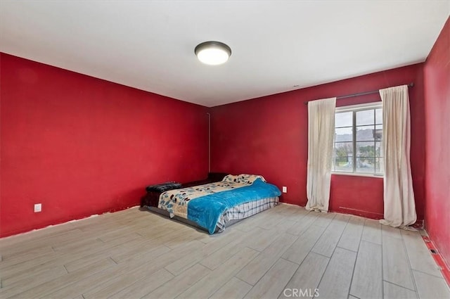 unfurnished bedroom featuring light wood-type flooring