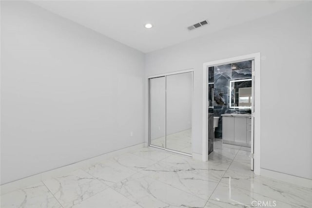 7631 Columbia St, Rosemead, CA 91770 - unfurnished bedroom with light marble finish floors, recessed lighting, a closet, baseboards, and ensuite bath