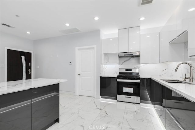 7631 Columbia St, Rosemead, CA 91770 - kitchen featuring stainless steel range with gas cooktop, modern cabinets, a sink, white cabinetry, and under cabinet range hood