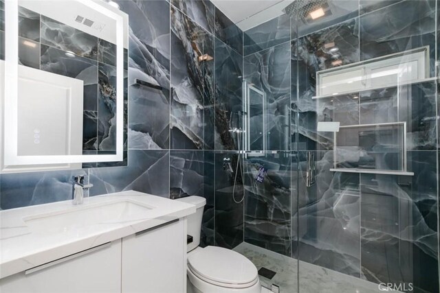 7631 Columbia St, Rosemead, CA 91770 - full bath featuring tile walls, a marble finish shower, toilet, vanity, and marble finish flooring
