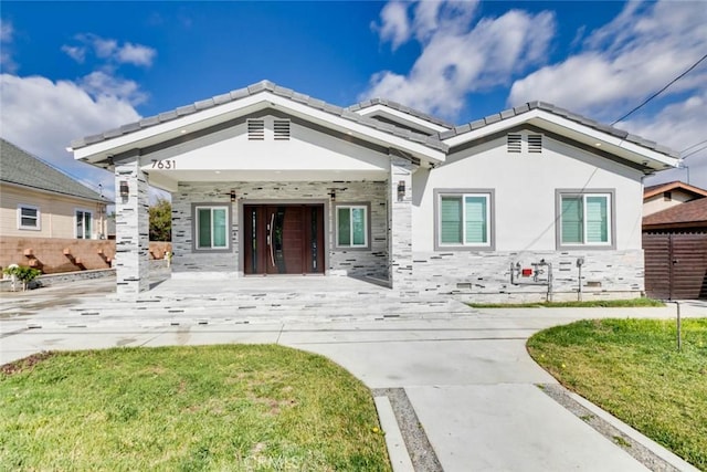 7631 Columbia St, Rosemead, CA 91770 - view of front of house with a porch, stone siding, a tile roof, and stucco siding