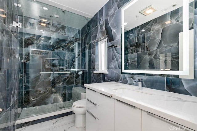 7631 Columbia St, Rosemead, CA 91770 - bathroom featuring tile walls, marble finish floors, toilet, a marble finish shower, and vanity