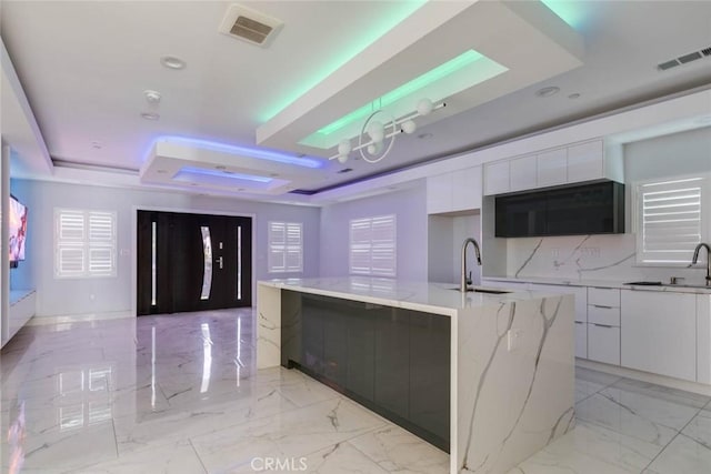 7631 Columbia St, Rosemead, CA 91770 - kitchen featuring modern cabinets, a sink, a tray ceiling, white cabinetry, and recessed lighting