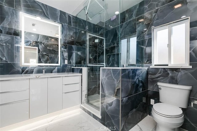 7631 Columbia St, Rosemead, CA 91770 - full bathroom with tile walls, marble tiled floors, a shower stall, vanity, and toilet