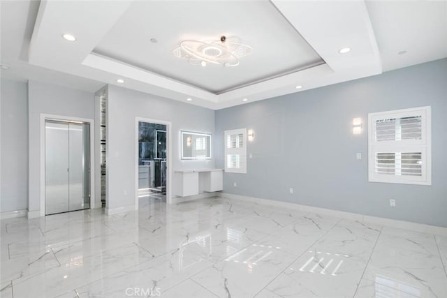 7631 Columbia St, Rosemead, CA 91770 - spare room with baseboards, a tray ceiling, recessed lighting, and marble finish flooring