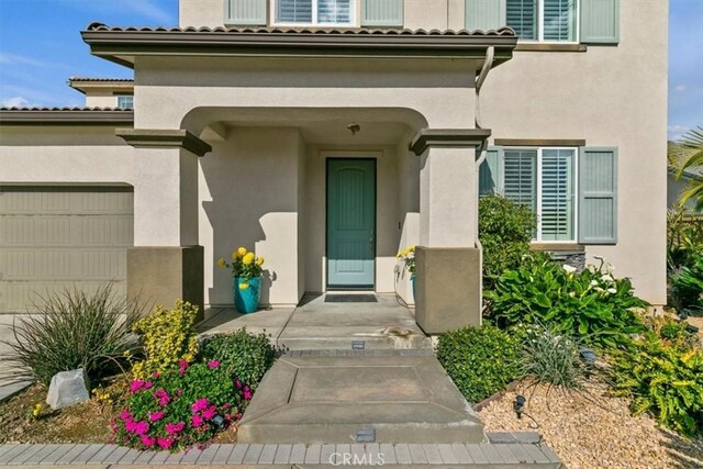 doorway to property featuring a garage