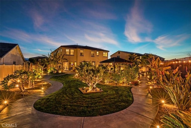 view of yard at dusk