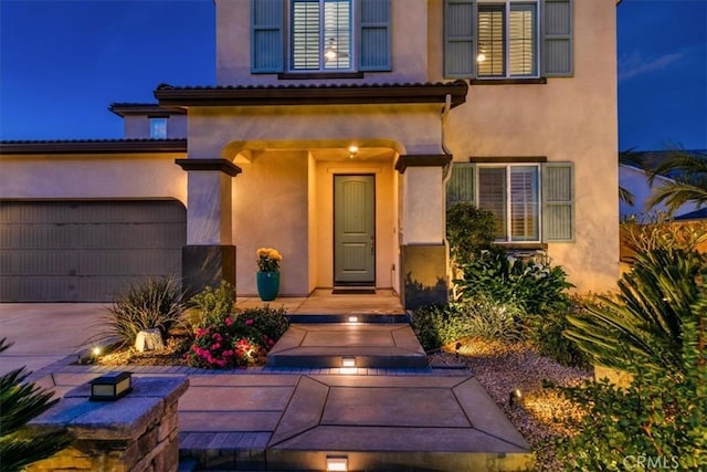 doorway to property featuring a garage