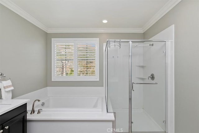 bathroom with vanity, ornamental molding, and plus walk in shower