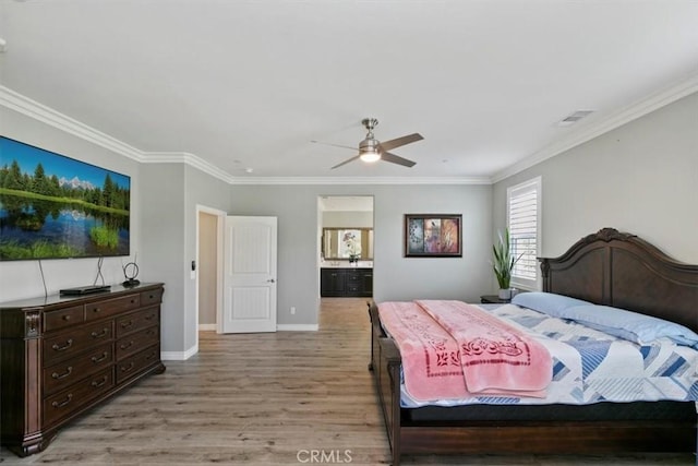 bedroom with crown molding, ceiling fan, ensuite bathroom, and light hardwood / wood-style floors