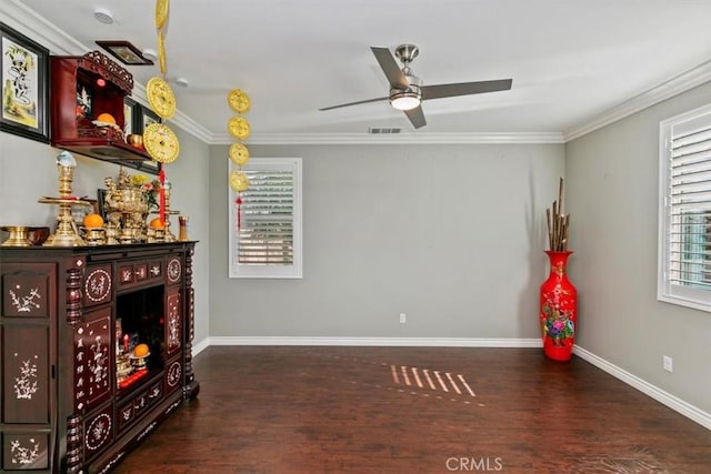 interior space featuring crown molding, dark hardwood / wood-style floors, and ceiling fan