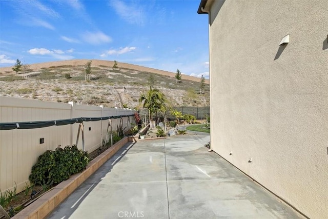 view of patio / terrace with a mountain view