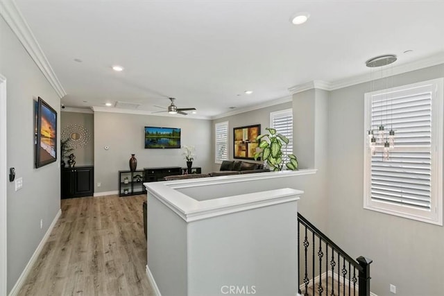 hallway with crown molding and light wood-type flooring