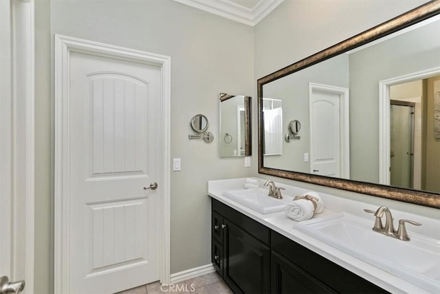 bathroom featuring tile patterned flooring, vanity, and ornamental molding