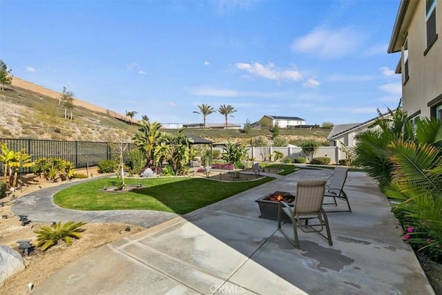 view of patio / terrace featuring an outdoor fire pit