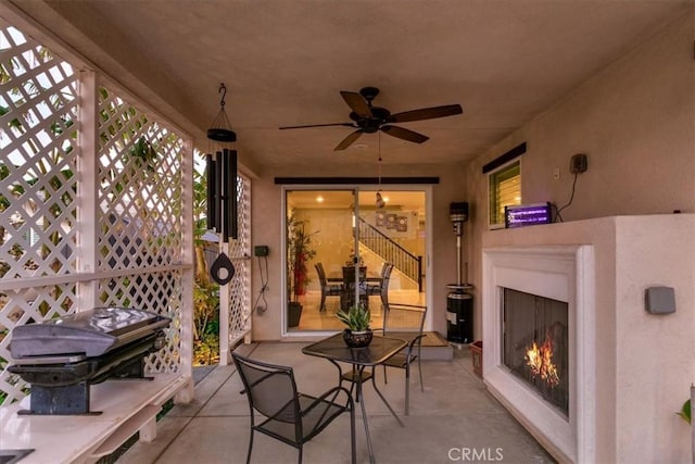 view of patio / terrace with exterior fireplace