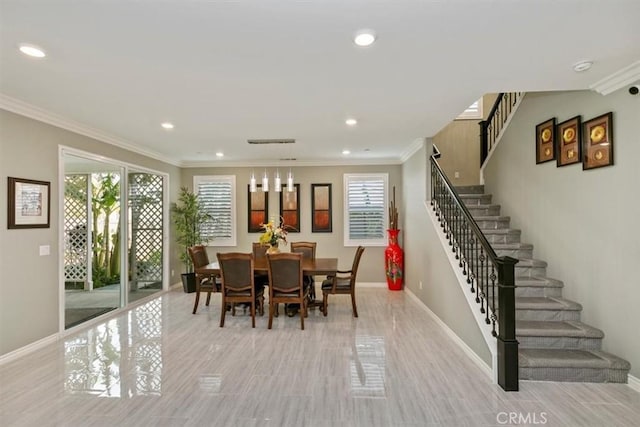 dining area with crown molding and plenty of natural light