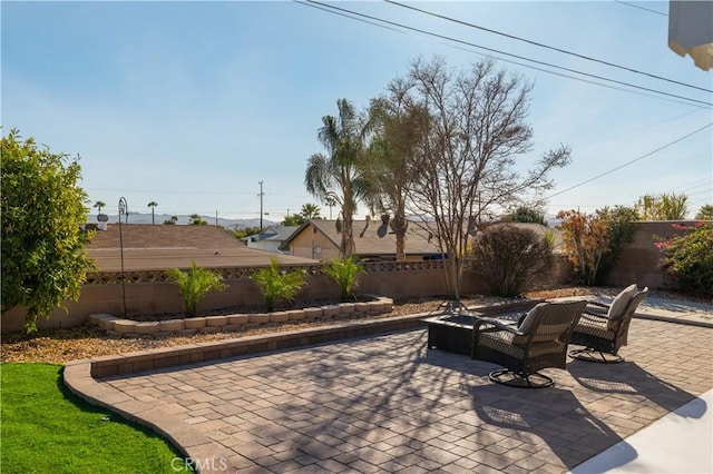 view of patio / terrace with a fire pit