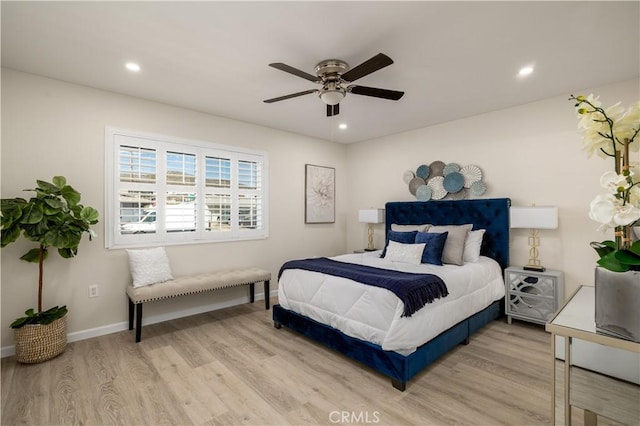 bedroom featuring light hardwood / wood-style flooring and ceiling fan