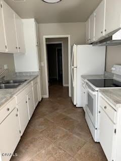 kitchen featuring sink, white cabinets, and white appliances