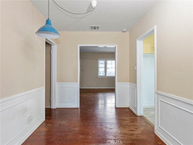 corridor with dark wood-type flooring