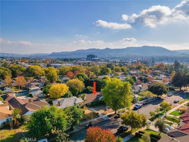 birds eye view of property featuring a mountain view