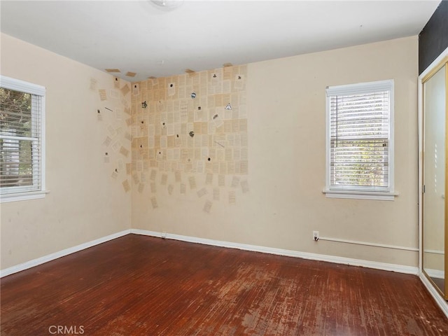 empty room featuring hardwood / wood-style flooring