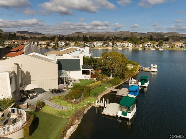 bird's eye view featuring a water and mountain view and a residential view