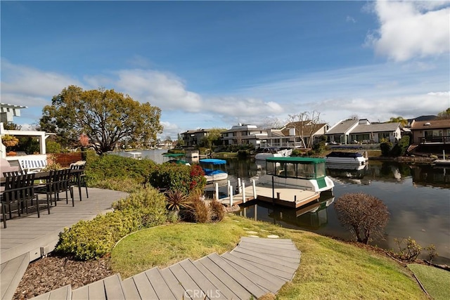 dock area featuring a residential view and a water view