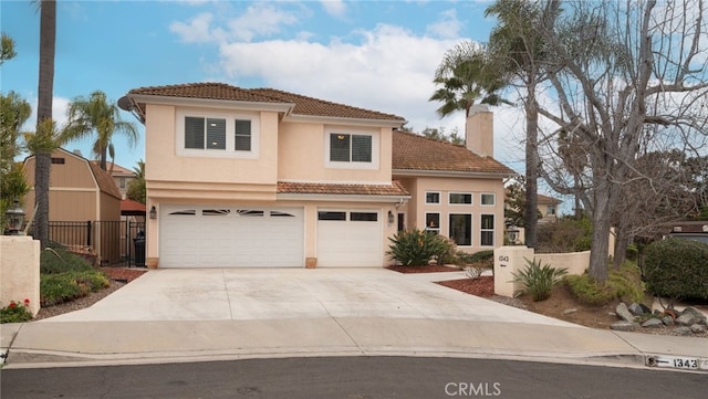 mediterranean / spanish-style home featuring a garage