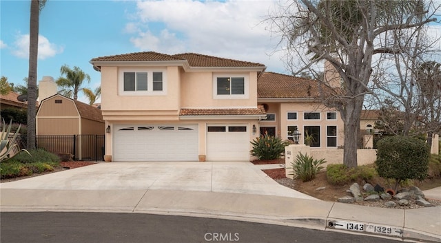 mediterranean / spanish-style home with a garage