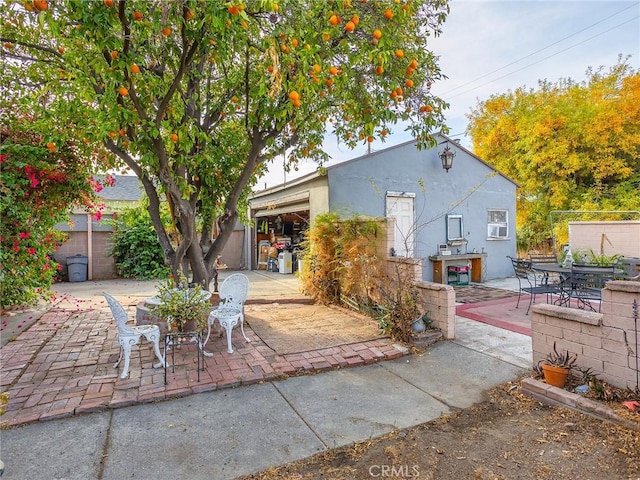 rear view of house featuring a patio